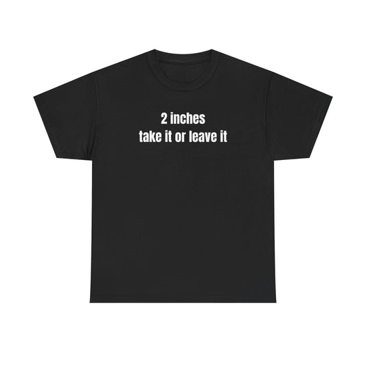 A black crew neck t-shirt with the text '2 inches take it or leave it' printed on the front.