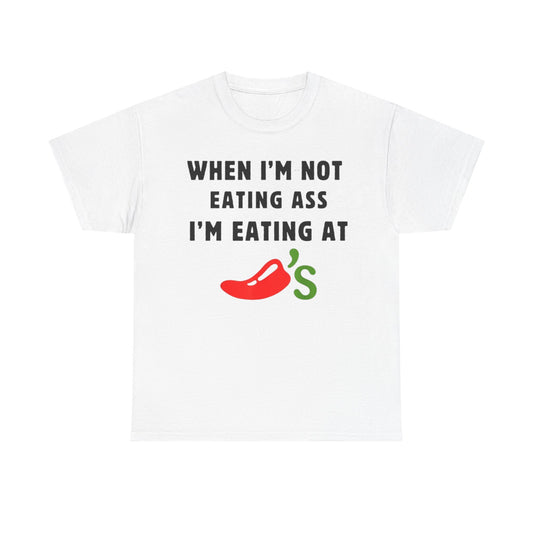 White crew neck t-shirt with the text 'WHEN I'M NOT EATING ASS I'M EATING AT CHILIS' printed on the front.