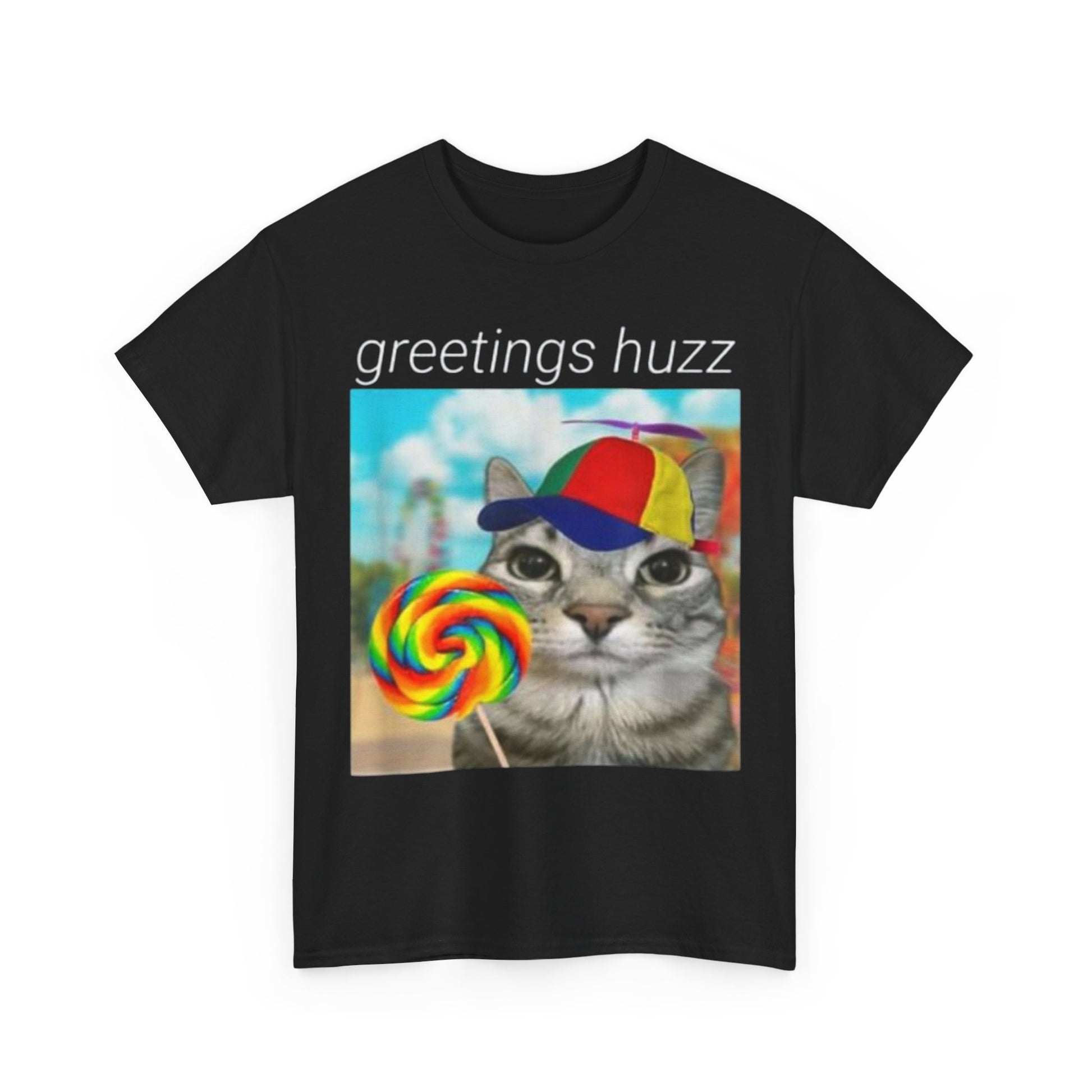 A black crew neck t-shirt with the text 'greetings buzz' and a graphic print of a cat wearing a hat and holding a lollipop.