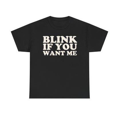 A black crew neck t-shirt with the text 'BLINK IF YOU WANT ME' printed in white on the front.